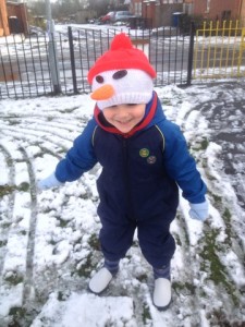Snowman hat keeping cold ears warm as toast