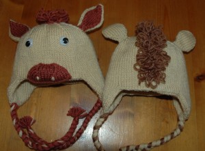 Back and front of the baby horse hats